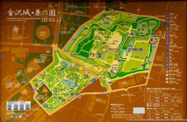 Colorful illustrated site map showing Kanazawa Castle Park, gardens, paths, walls, buildings, and visitor symbols.