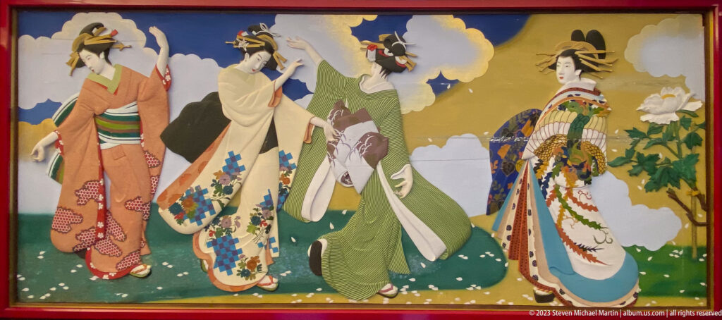 Women in layered floral kimono stand against a gold ground with blossoms and stylized clouds.