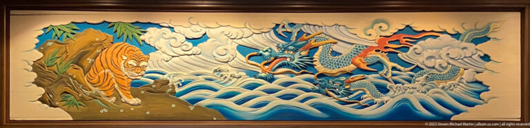 Tiger on rocky ground confronts a dragon rising from turbulent waves, clouds, and mountains.