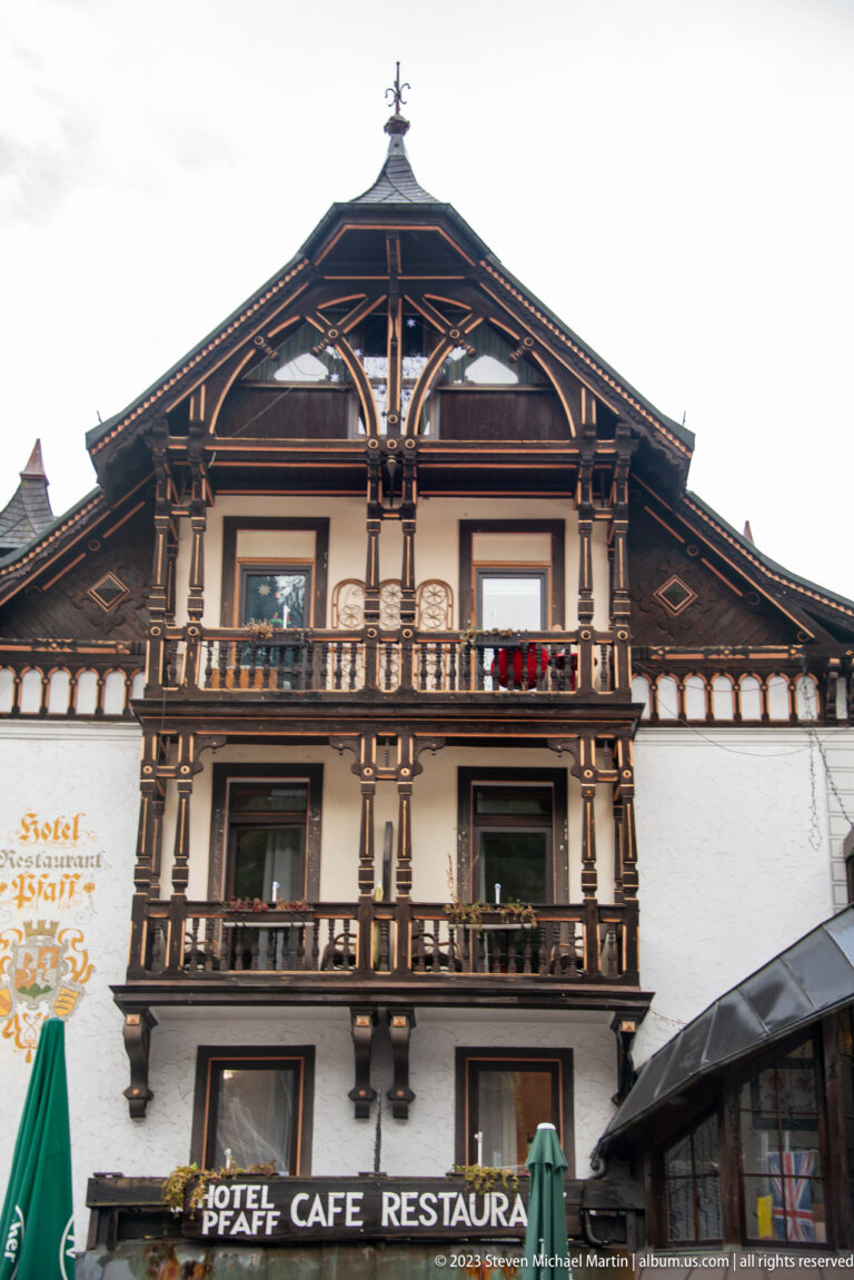 Ornately timbered façade of Hotel Pfaff in Triberg with balconies and Hotel Pfaff Cafe Restaurant signage.