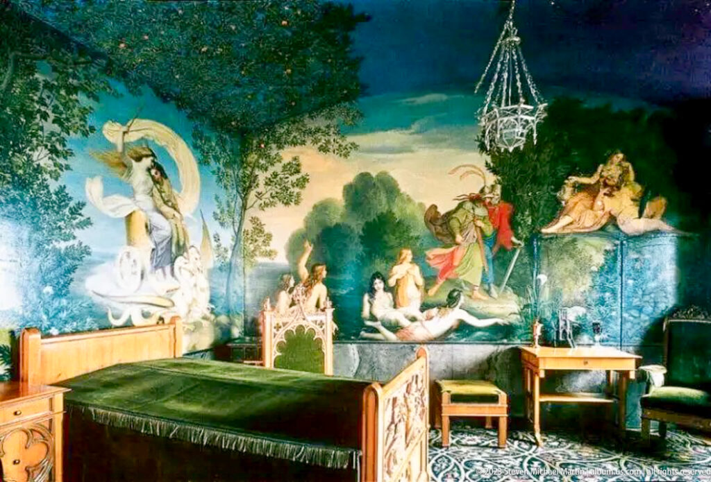 Dark green-covered bed beneath a panoramic mythological mural in a richly decorated Hohenschwangau Castle bedroom.