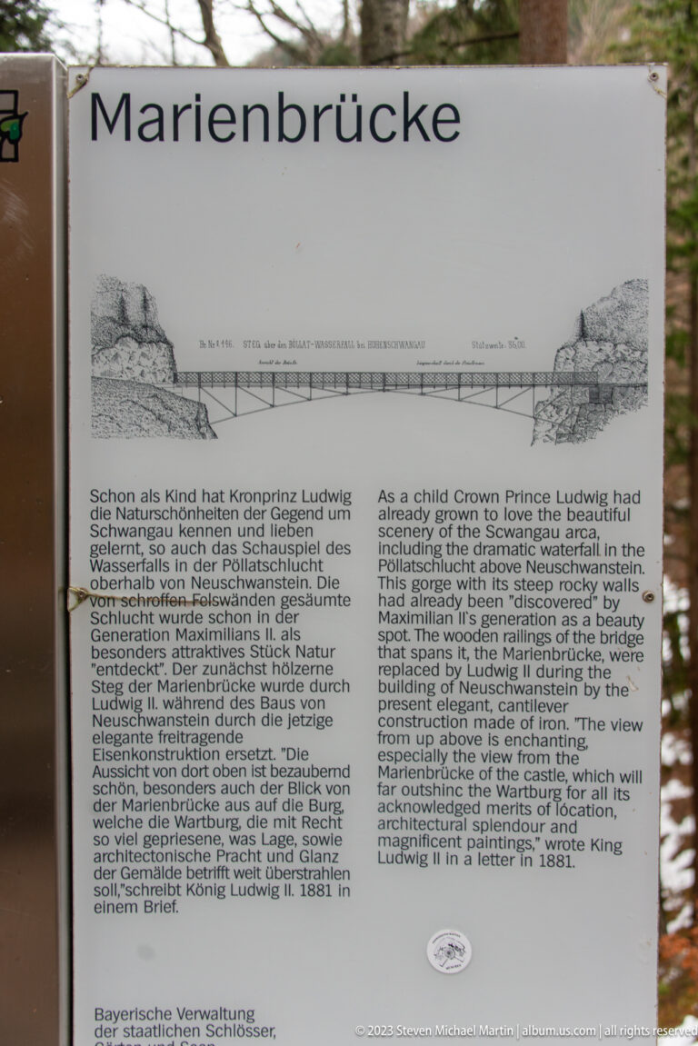 Bilingual Marienbrücke interpretive sign with a historical bridge drawing and German and English text.