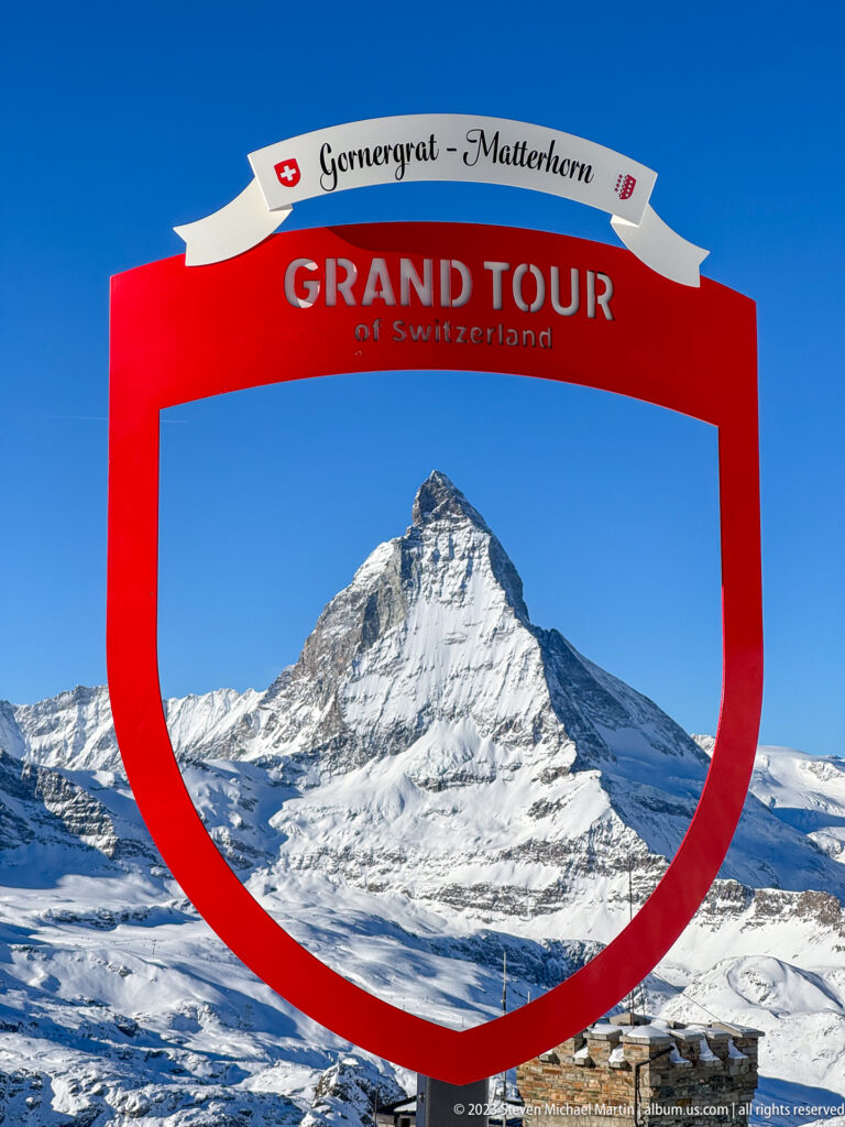 Matterhorn framed inside a red Grand Tour of Switzerland photo installation labeled Gornergrat – Matterhorn.