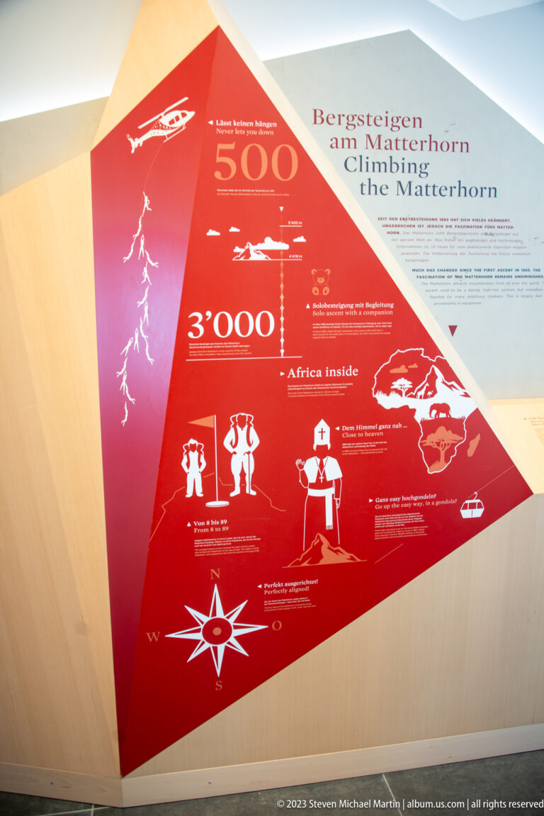Red-and-white Matterhorn climbing-history exhibit with dates, route graphics, silhouettes, and bilingual German-English title.