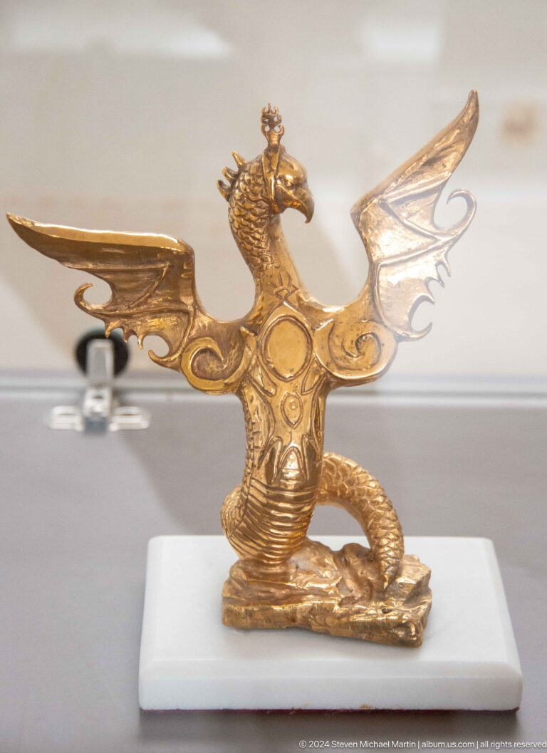 Ornate gold animal-shaped fitting.