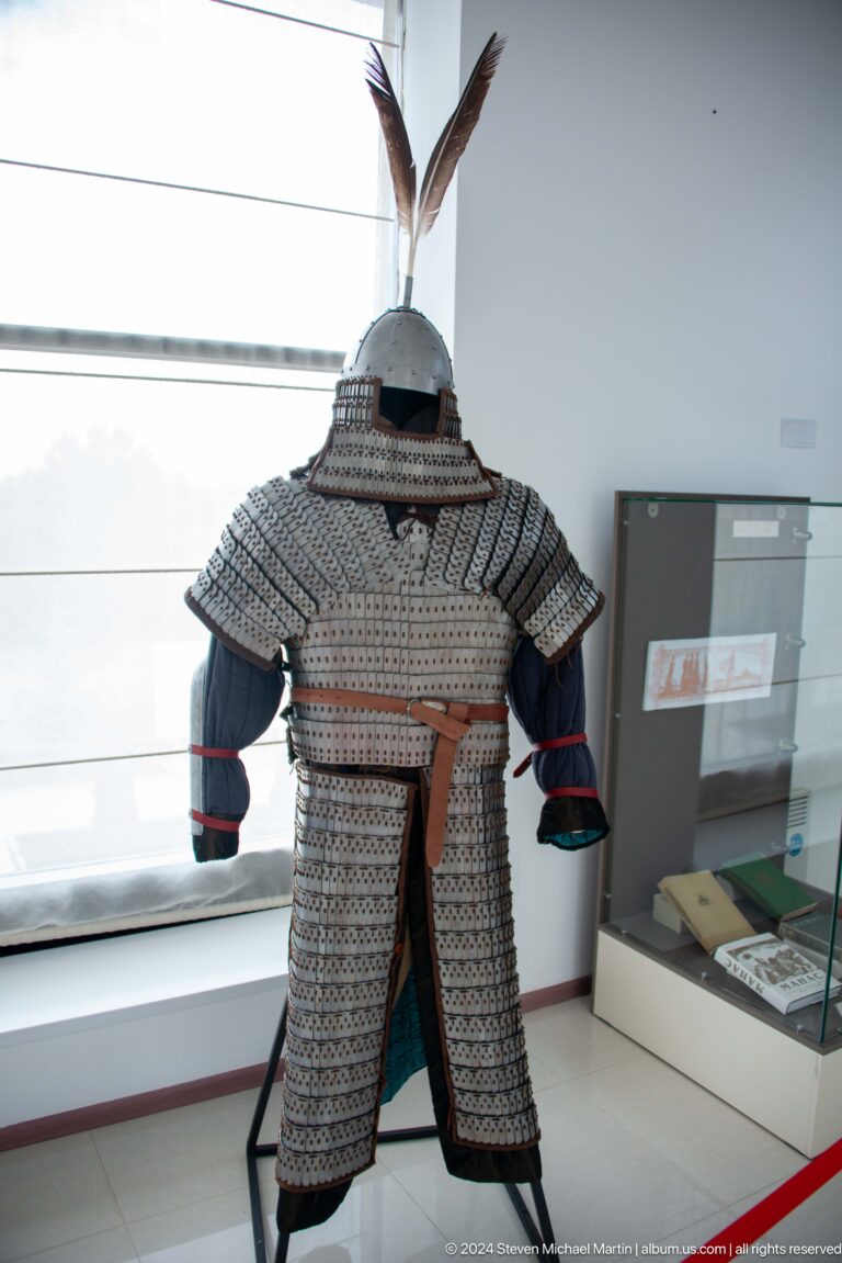 Gray chainmail or scale armor on mannequin.