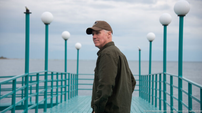 Side portrait of man on the pier.