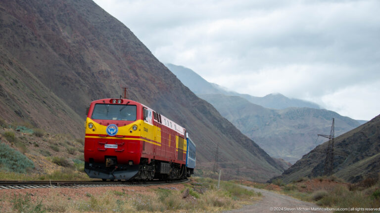 Front view of a red-and-yellow locomotive.