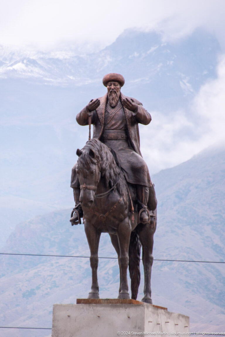 Close view of bronze rider and horse.