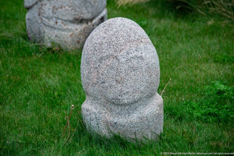 Rounded anthropomorphic stone sculpture.