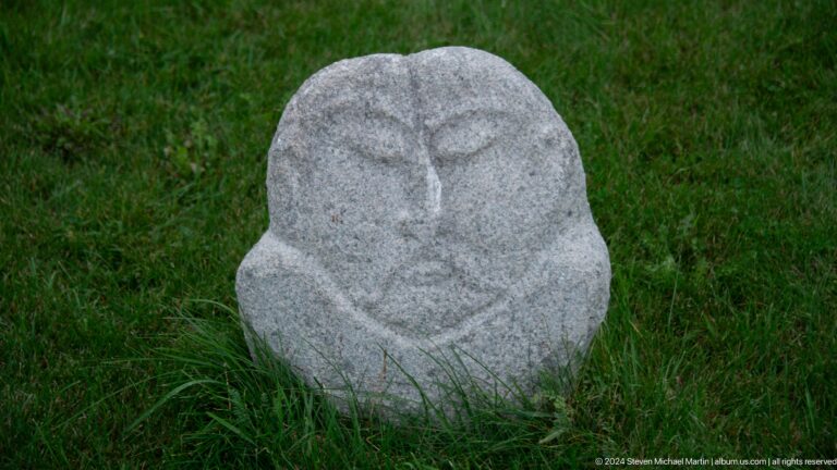 Rounded carved stone head or figure.