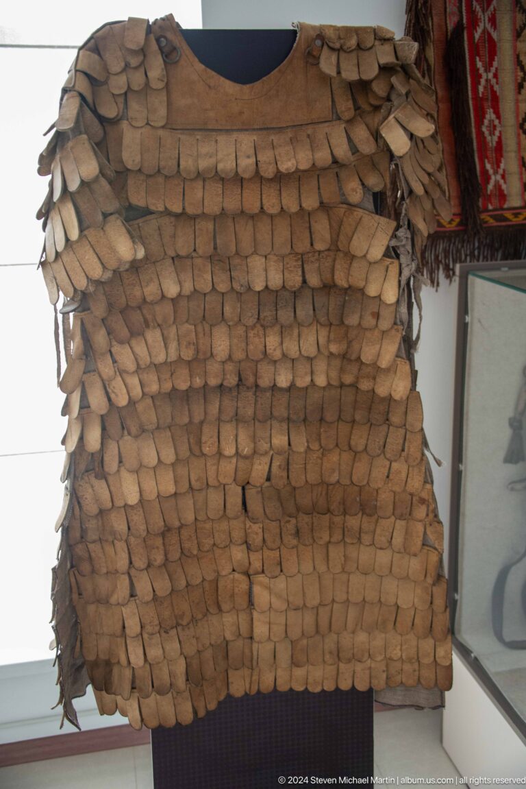 Close view of layered wooden scale-like pieces.