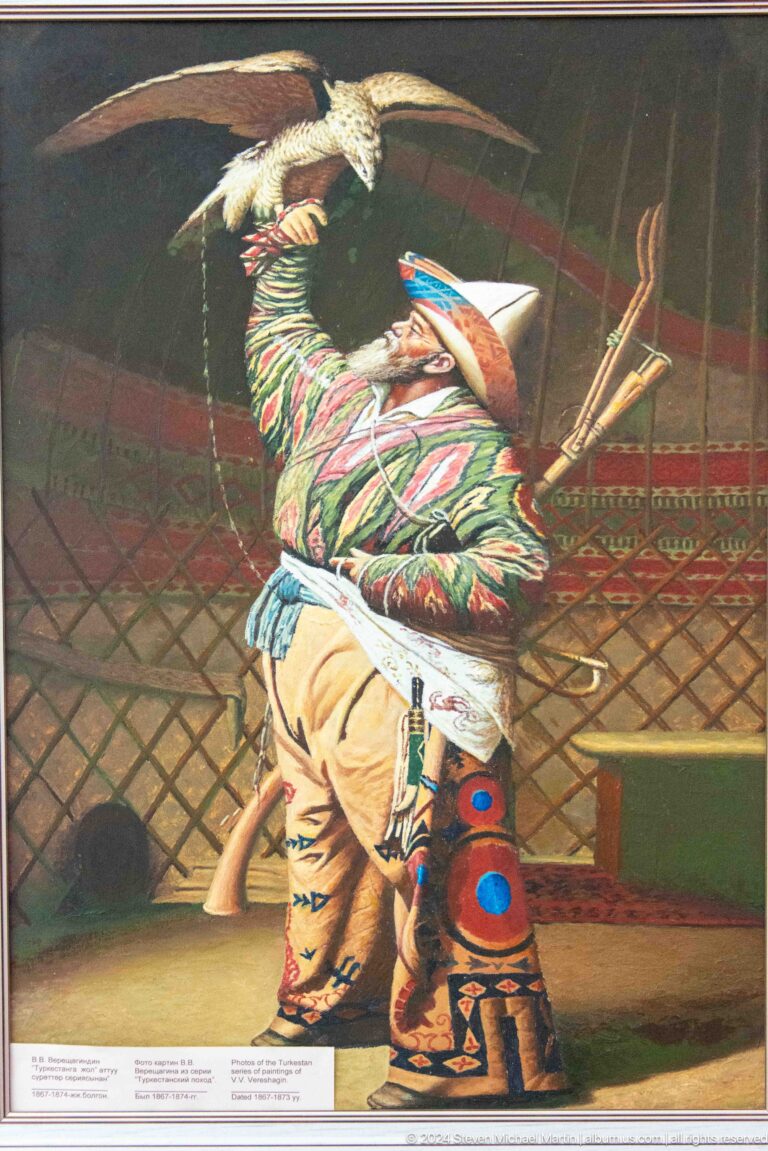 Woman in patterned costume within a yurt interior.