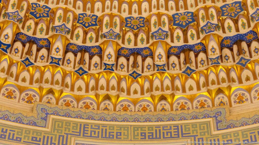 Dense tiers of blue, white, and gold niche-like ornament.