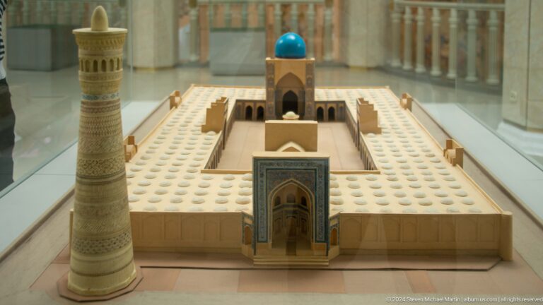 Courtyard model with portal, minaret, and turquoise dome.