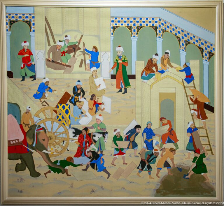 Workers carry materials and use tools around arches.