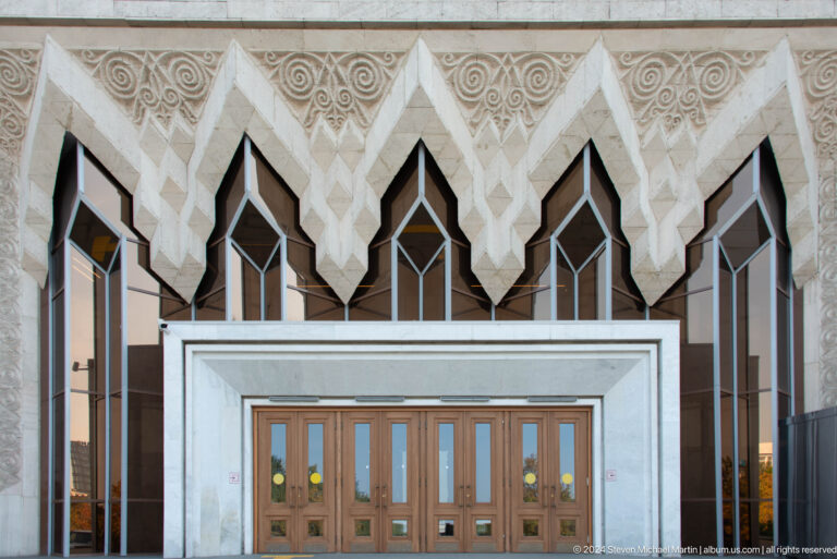 Ornamental entrance of the Palace of the Republic with pointed white façade motifs in Almaty, Kazakhstan.
