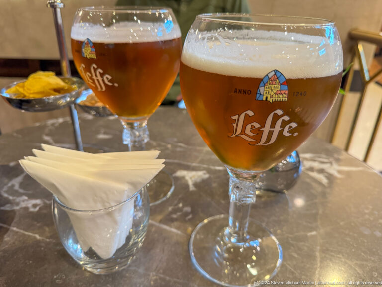 Two glasses of Leffe beer on a restaurant table in Almaty, Kazakhstan.