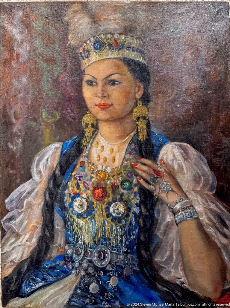 Medium view of a painted portrait of a woman in traditional costume and jewelry at the Central State Museum of Kazakhstan in Almaty.