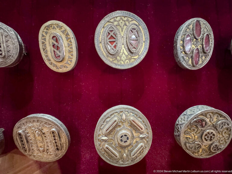 Medium view of silver belt plaques on display at the Central State Museum of Kazakhstan in Almaty.