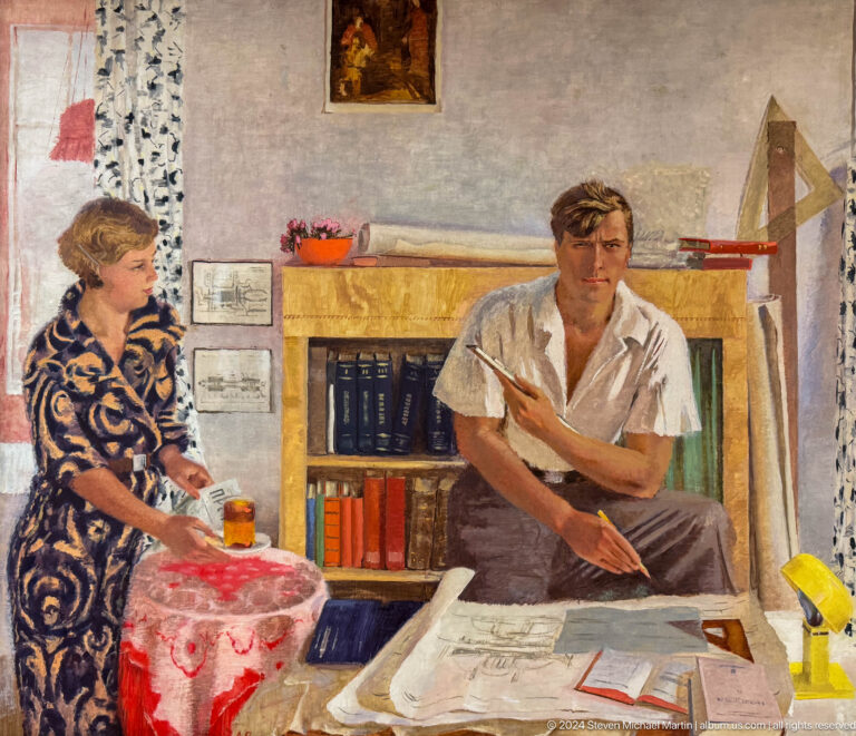 Woman and seated man in domestic interior.