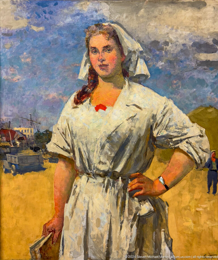 Confident woman standing with hand on hip.