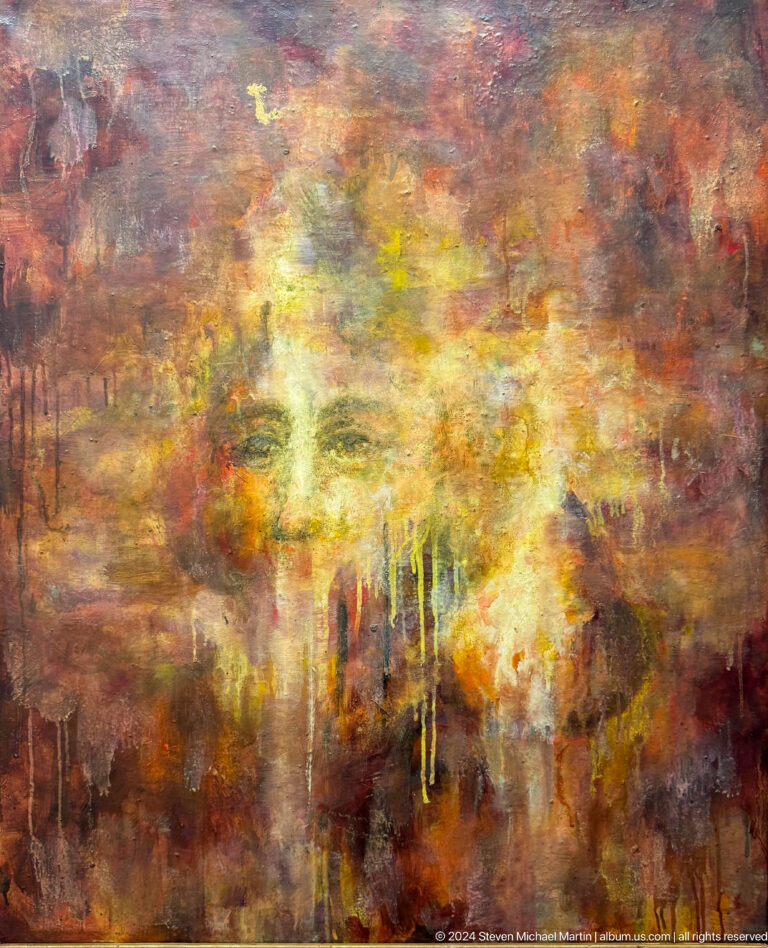 Large abstract portrait emerging through warm colors.