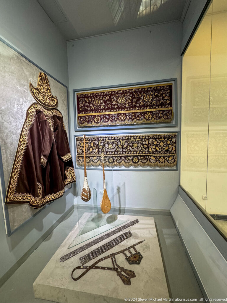 Traditional garment with scale and textile borders.