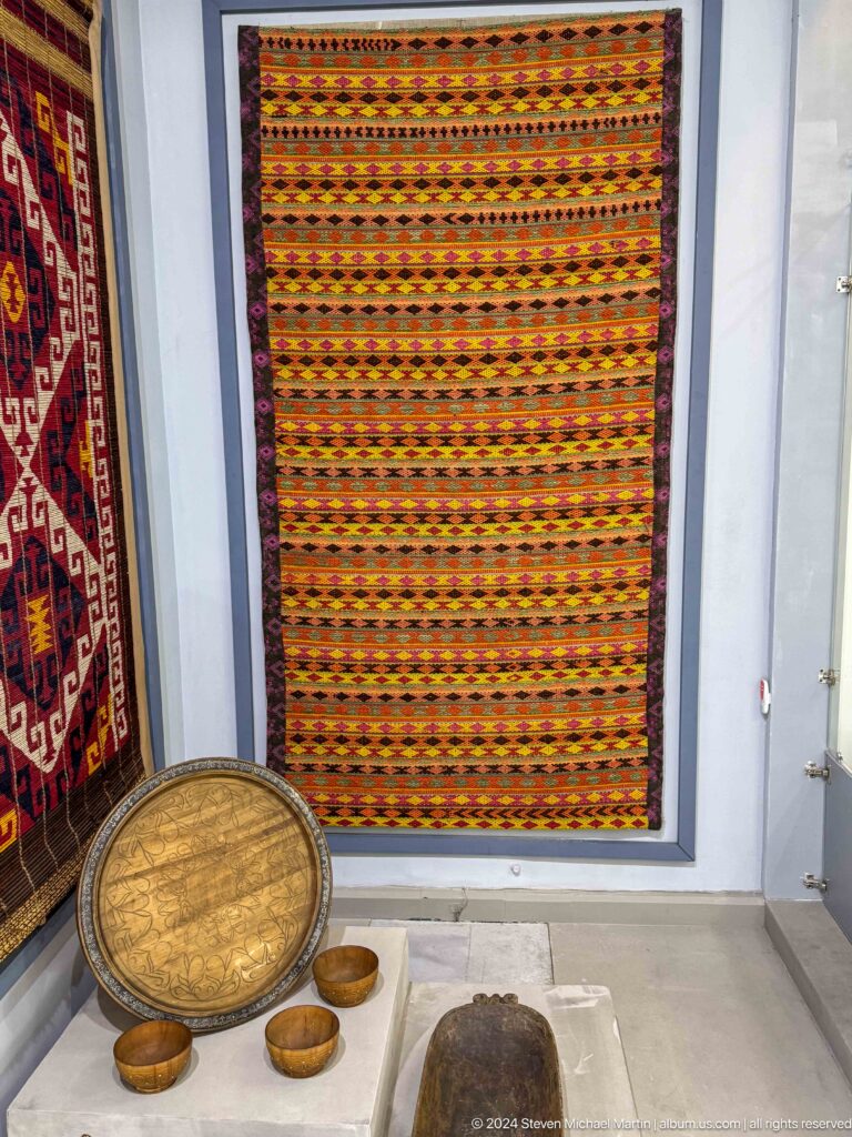 Orange patterned carpet filling display bay.