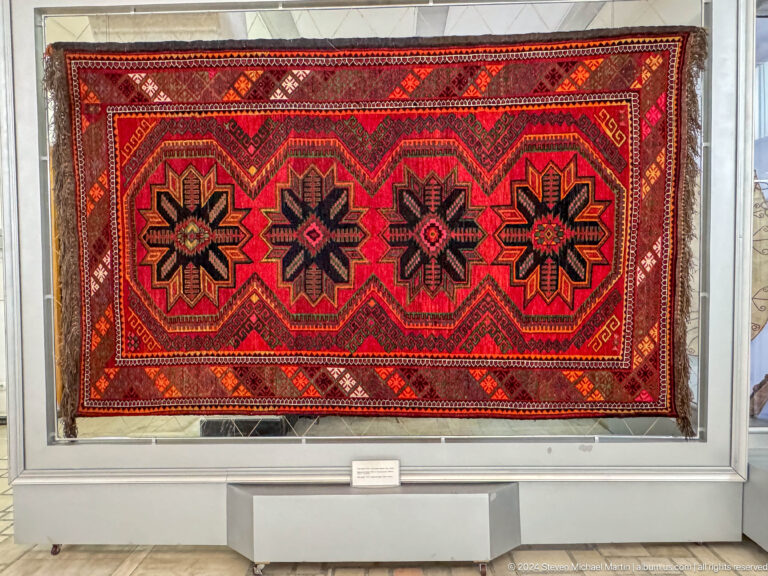 Red carpet with black star motifs.