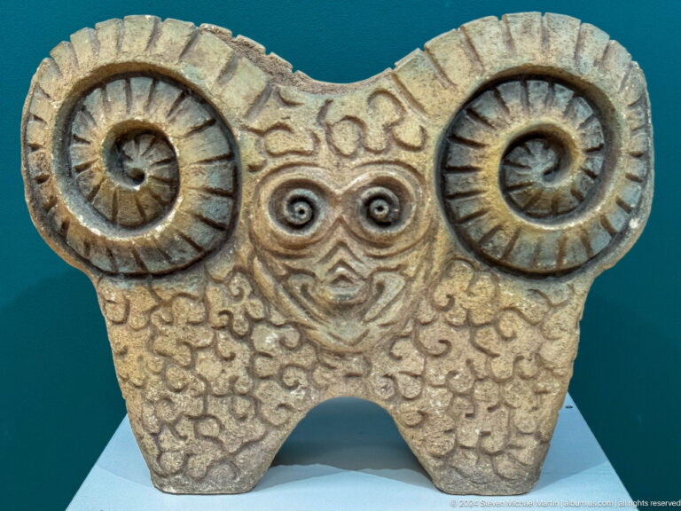 Ceramic ram head with spiral horns.