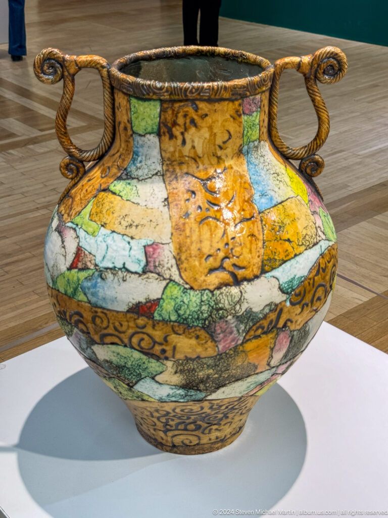 Painted ceramic vessel with figurative scenes.