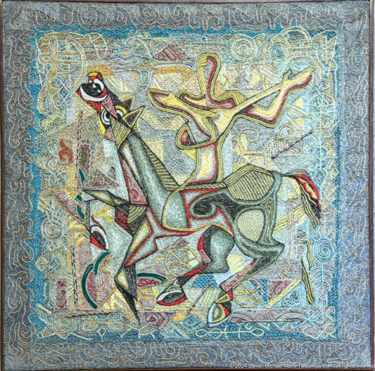 Blue textured composition with antlered animal.
