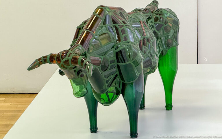 Green translucent bull sculpture.