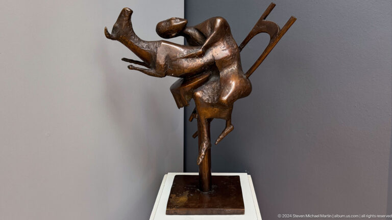 Small dynamic figure balancing on one leg.
