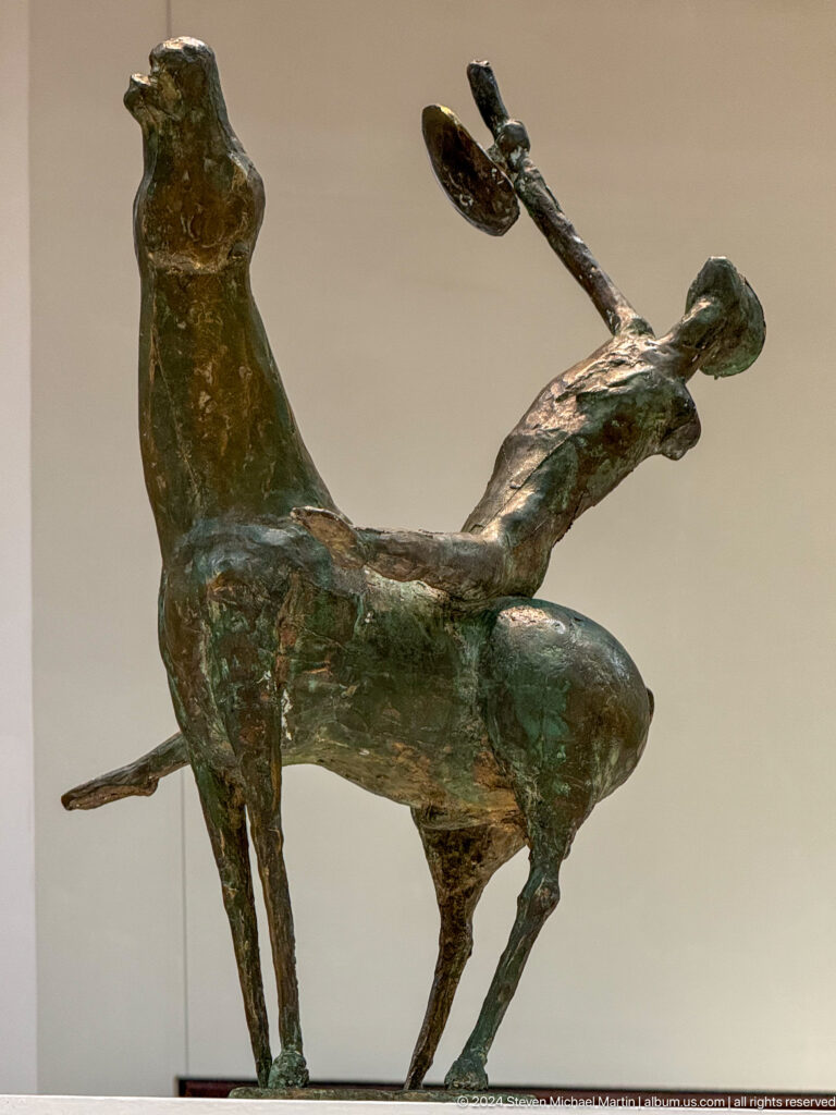 Horse and rider in energetic pose.