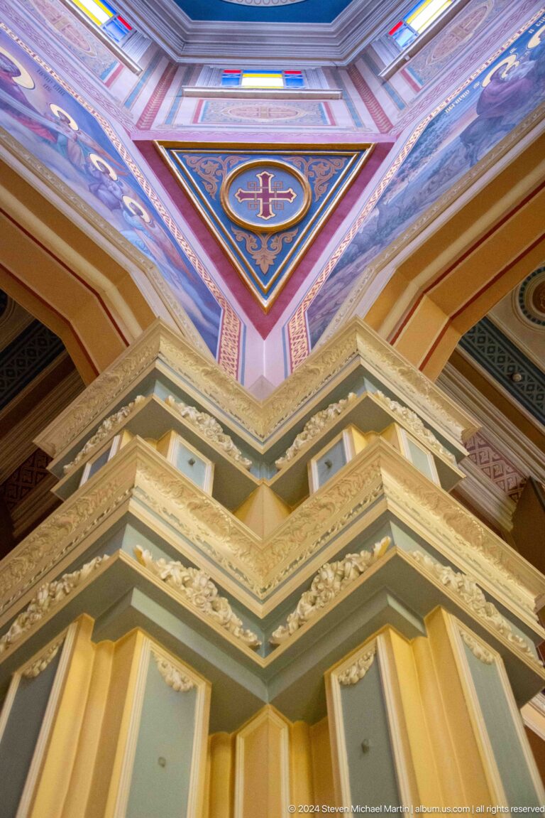 Painted architectural ceiling corner inside Zenkov Cathedral, with Orthodox religious decoration.