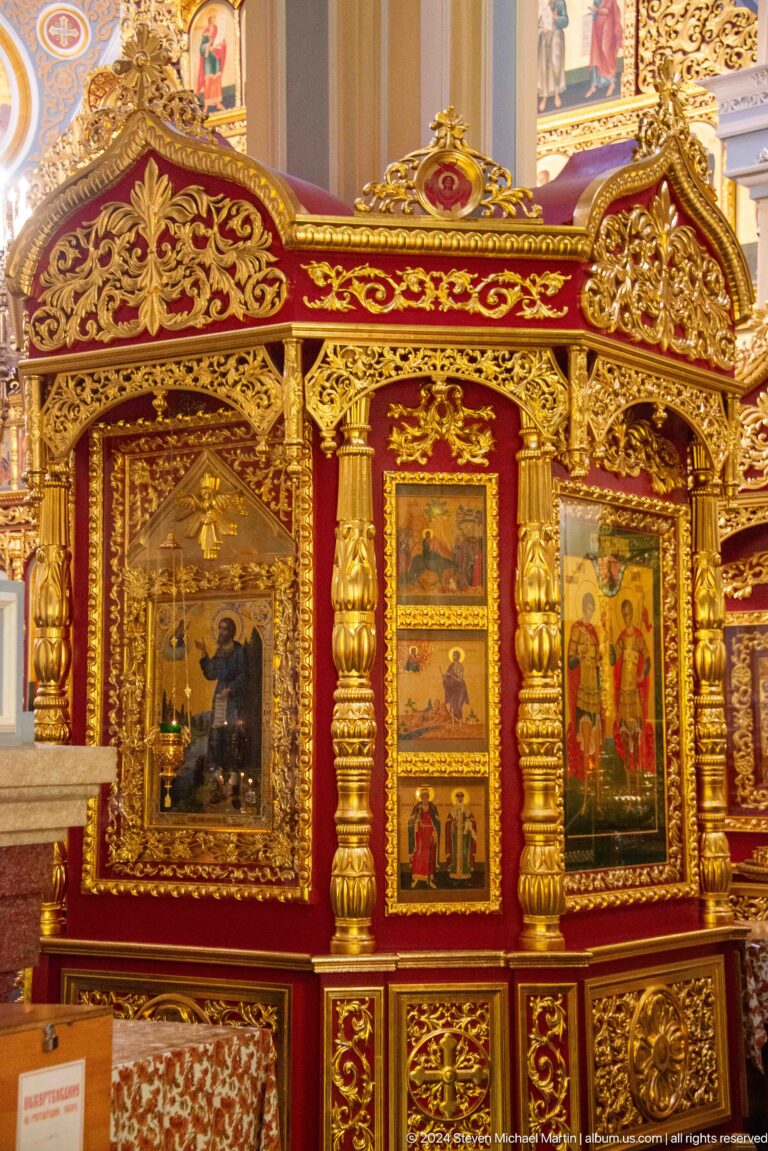 Gilded iconostasis panel inside Zenkov Cathedral, with Orthodox religious decoration.