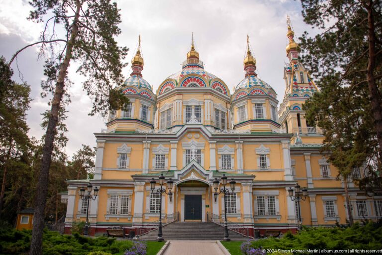 Daylight side elevation with domes at the colorful wooden Zenkov Cathedral in Almaty.