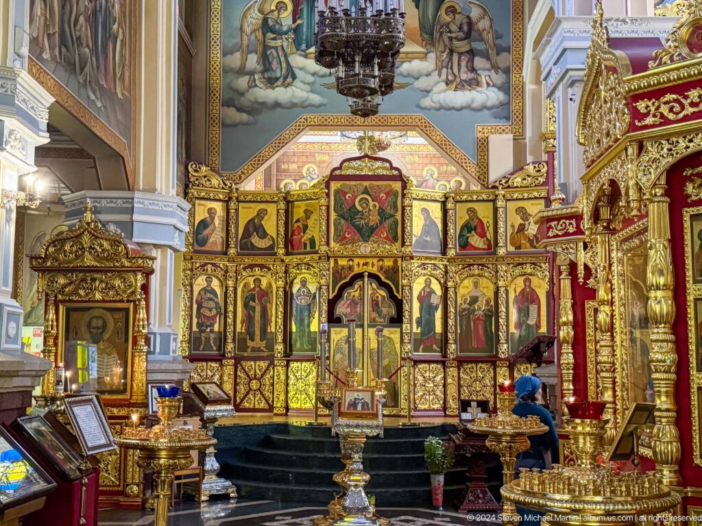 Iconostasis and sanctuary inside Zenkov Cathedral, with Orthodox religious decoration.