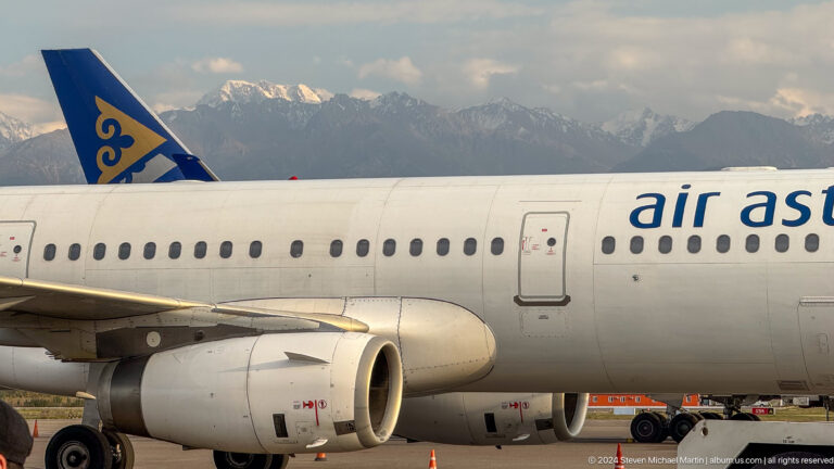 Air Astana passenger aircraft parked on airport apron in Bishkek, Kyrgyzstan.