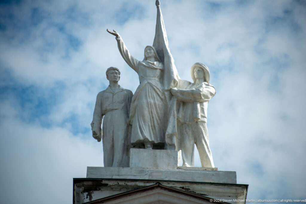 Heroic sculptural group with flag and figures in Bishkek, Kyrgyzstan.