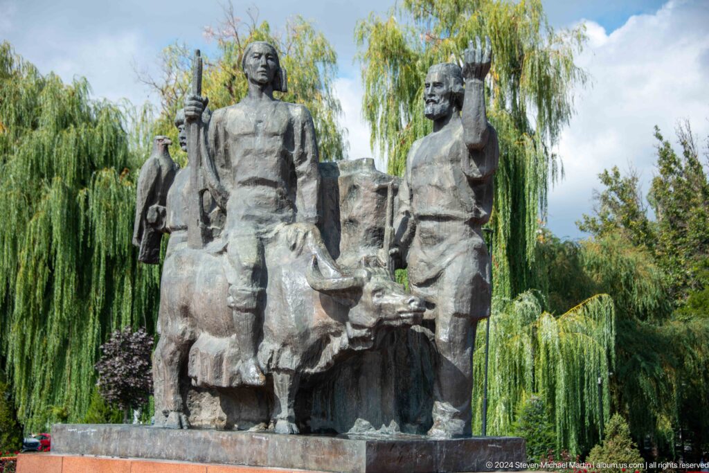 Second view of large stone memorial group in park in Bishkek, Kyrgyzstan.