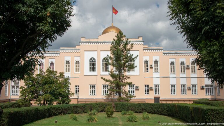 Pale neoclassical building with gold dome in Bishkek, Kyrgyzstan.