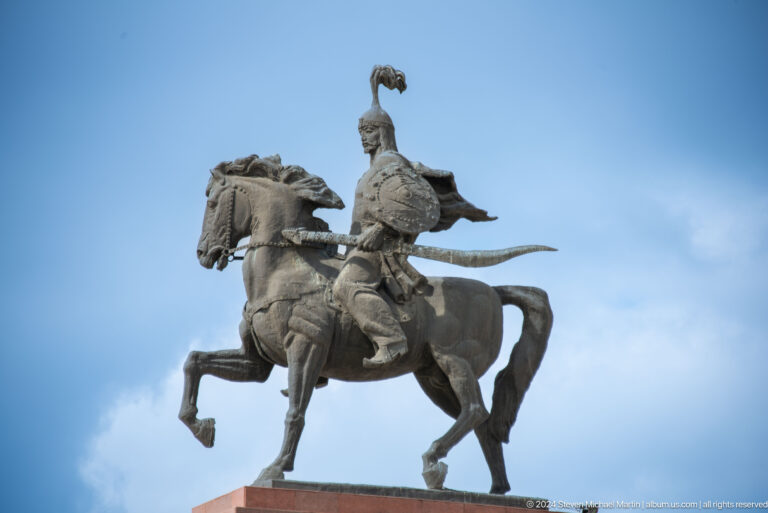 Equestrian statue against blue sky in Bishkek, Kyrgyzstan.