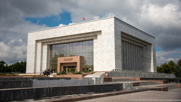 Monumental marble building with broad glass facade in Bishkek, Kyrgyzstan.
