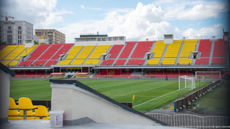 Stadium with red and yellow seating in Bishkek, Kyrgyzstan.
