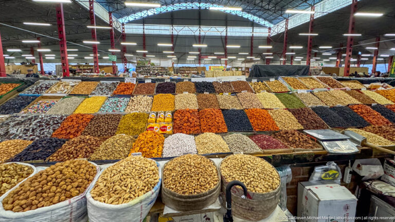 Rows of nuts and dried fruit in open market in Bishkek, Kyrgyzstan.