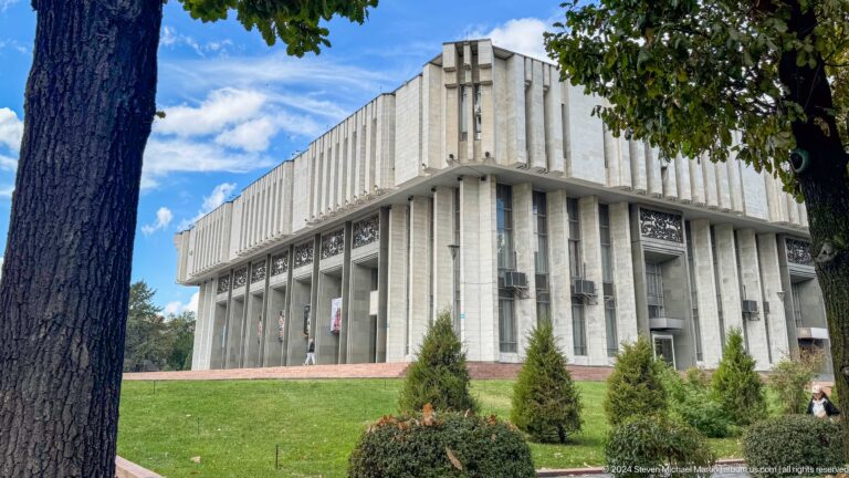 Rectangular Soviet modernist building in park in Bishkek, Kyrgyzstan.