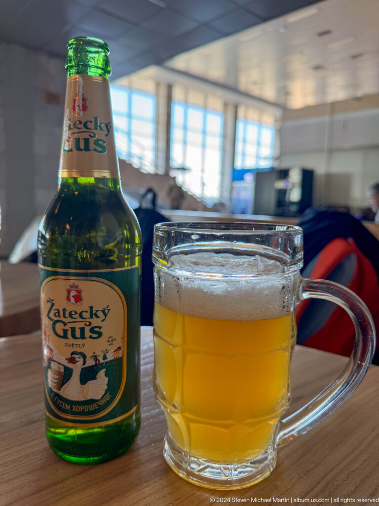 Beer bottle and frosted mug on table in Bishkek, Kyrgyzstan.